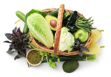 Photo of Superfood. Healthy food products in wicker basket isolated on white, top view