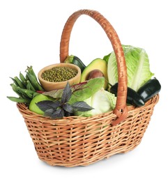 Photo of Superfood. Healthy food products in wicker basket isolated on white