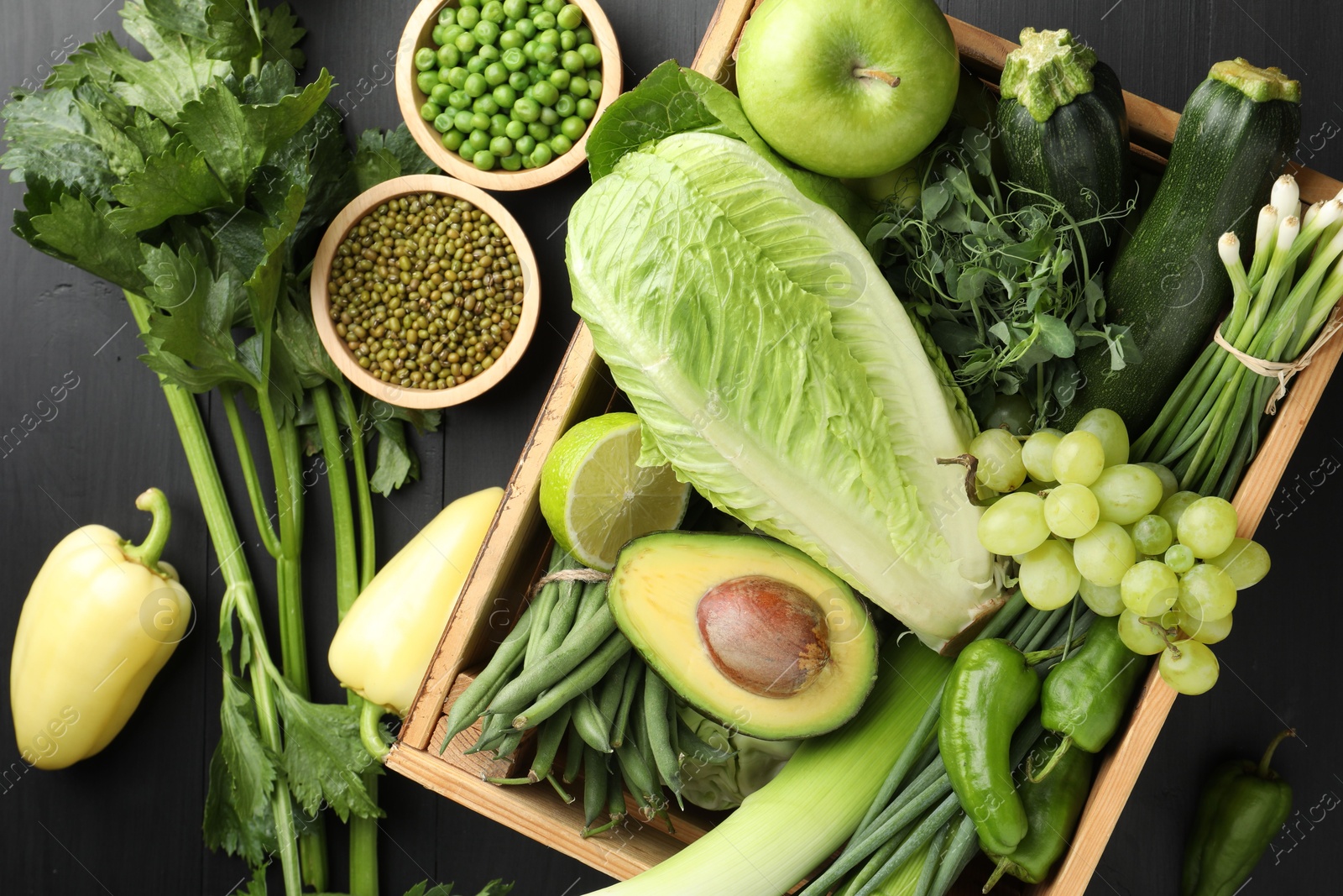 Superfood. Healthy food products on black wooden table, flat lay Photo of Superfood. Healthy food products on black wooden table, flat lay