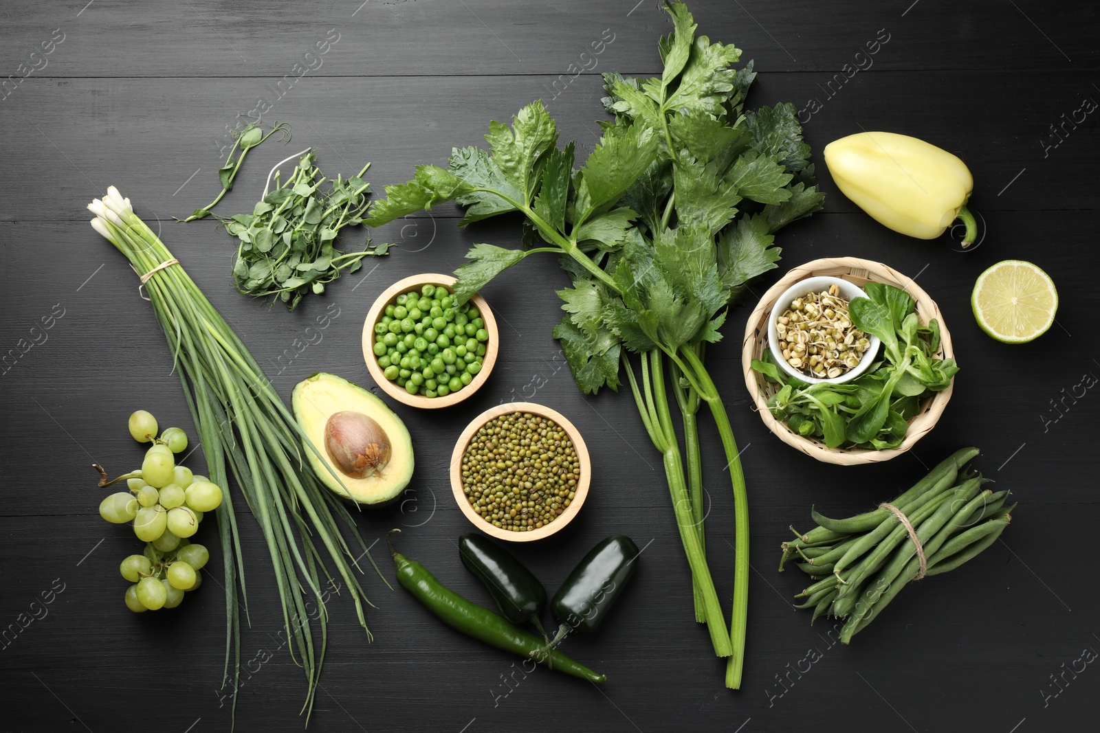 Superfood. Healthy food products on black wooden table, flat lay Photo of Superfood. Healthy food products on black wooden table, flat lay