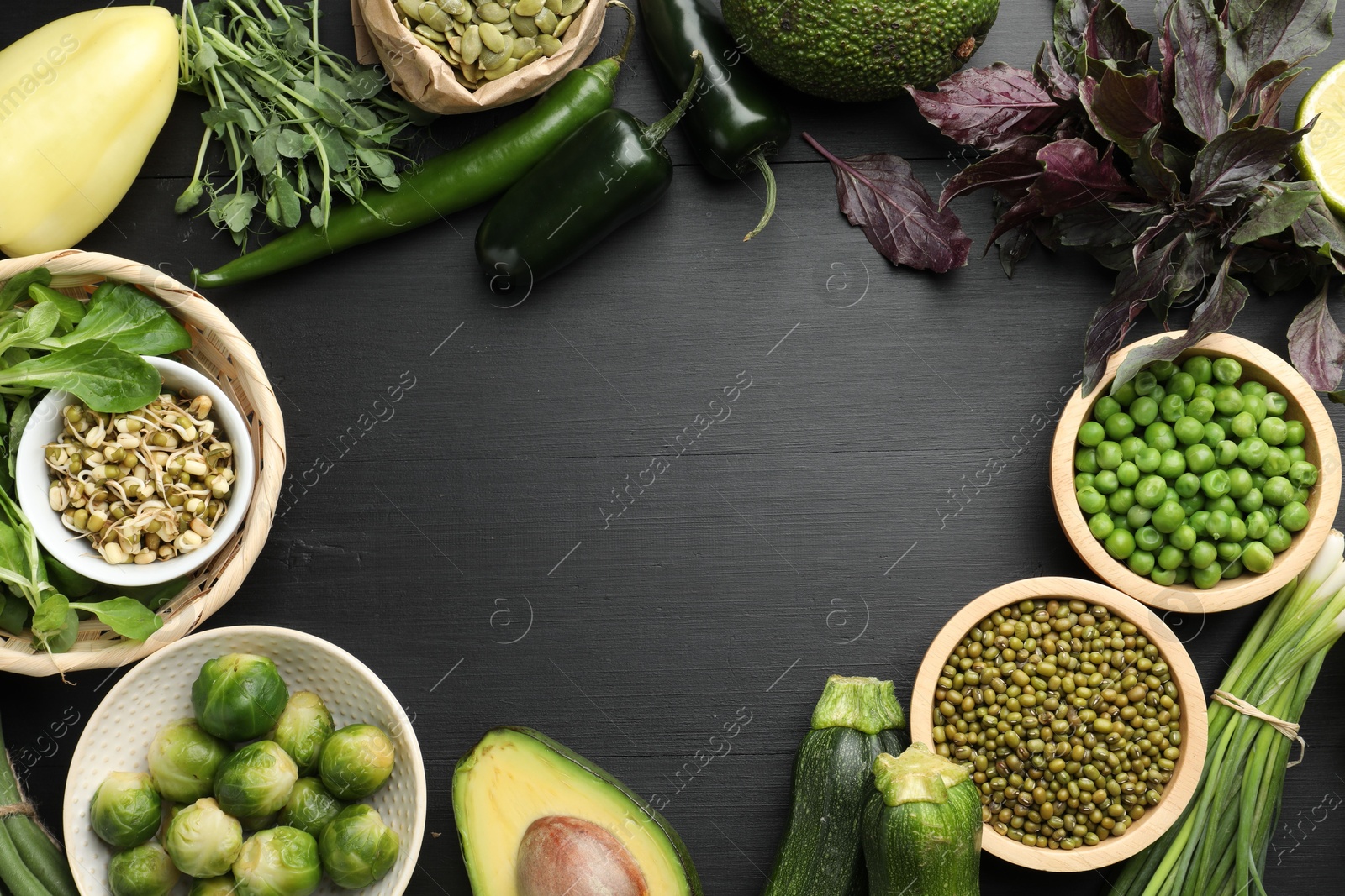 Superfood. Healthy food products on black wooden table, flat lay. Space for text Photo of Superfood. Healthy food products on black wooden table, flat lay. Space for text