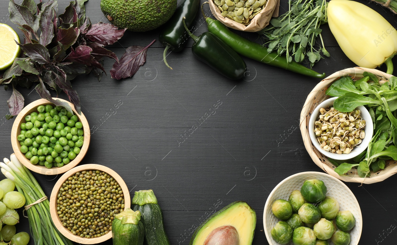 Superfood. Healthy food products on black wooden table, flat lay. Space for text Photo of Superfood. Healthy food products on black wooden table, flat lay. Space for text