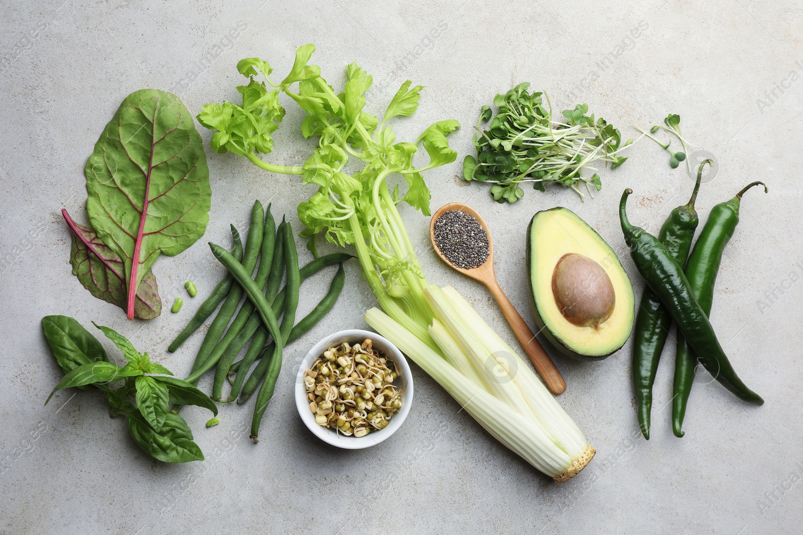 Photo of Superfood. Healthy food products on grey table, flat lay