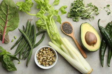 Photo of Superfood. Healthy food products on grey table, flat lay