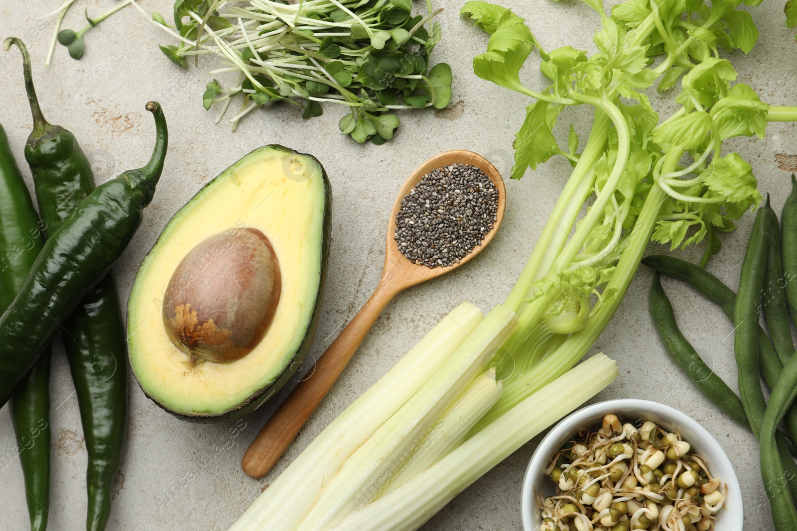 Superfood. Healthy food products on grey table, flat lay Photo of Superfood. Healthy food products on grey table, flat lay