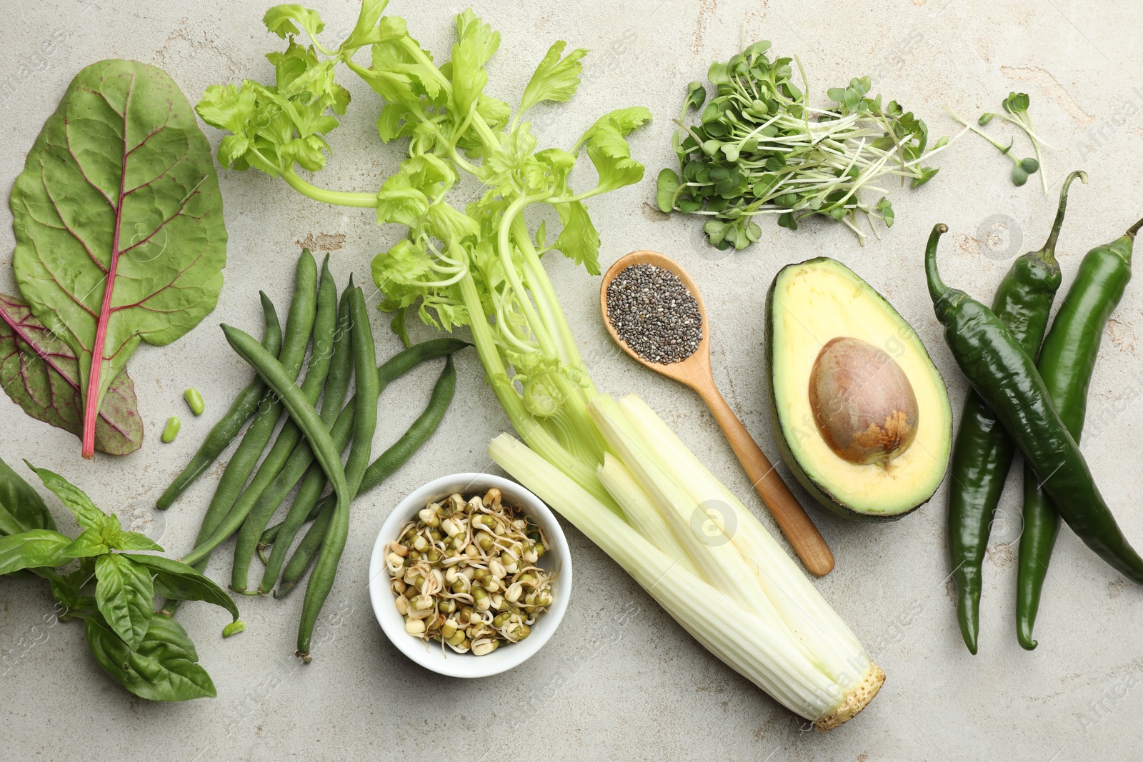 Photo of Superfood. Healthy food products on grey table, flat lay