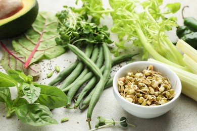 Photo of Superfood. Healthy food products on grey table, closeup