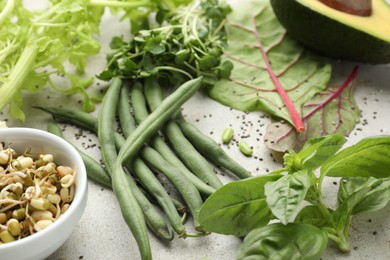 Photo of Superfood. Healthy food products on grey table, closeup