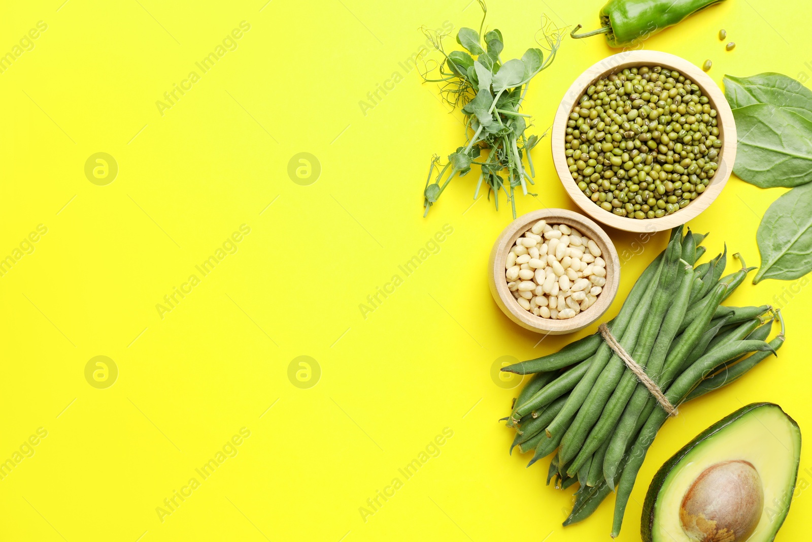 Superfood. Healthy food products on yellow background, flat lay. Space for text Photo of Superfood. Healthy food products on yellow background, flat lay. Space for text