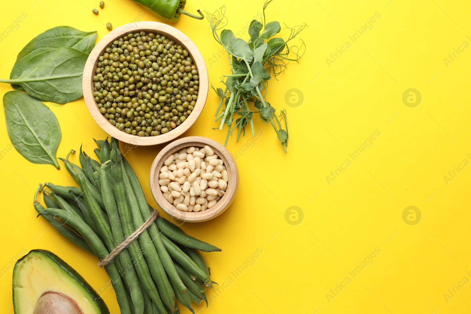 Superfood. Healthy food products on yellow background, flat lay. Space for text Photo of Superfood. Healthy food products on yellow background, flat lay. Space for text