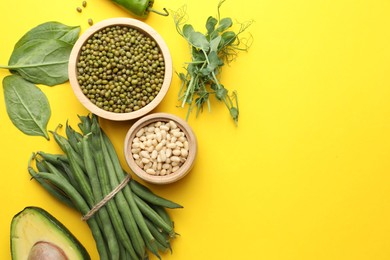 Photo of Superfood. Healthy food products on yellow background, flat lay. Space for text