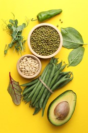 Photo of Superfood. Healthy food products on yellow background, flat lay