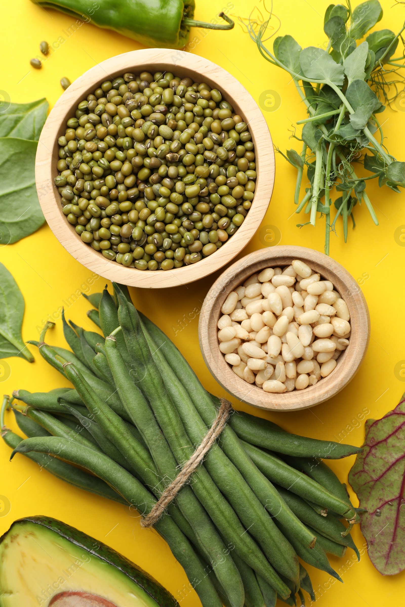 Superfood. Healthy food products on yellow background, flat lay Photo of Superfood. Healthy food products on yellow background, flat lay