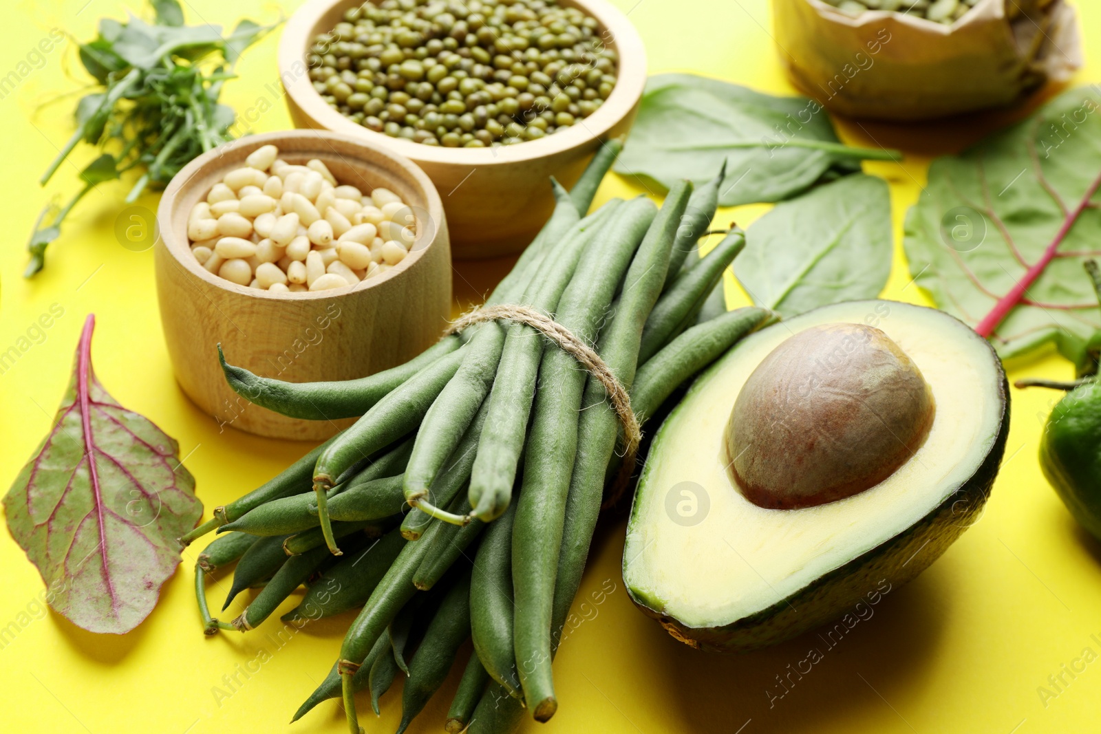 Superfood. Healthy food products on yellow background, closeup Photo of Superfood. Healthy food products on yellow background, closeup
