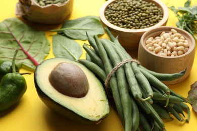 Photo of Superfood. Healthy food products on yellow background, closeup
