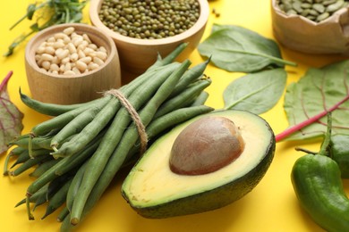 Photo of Superfood. Healthy food products on yellow background, closeup