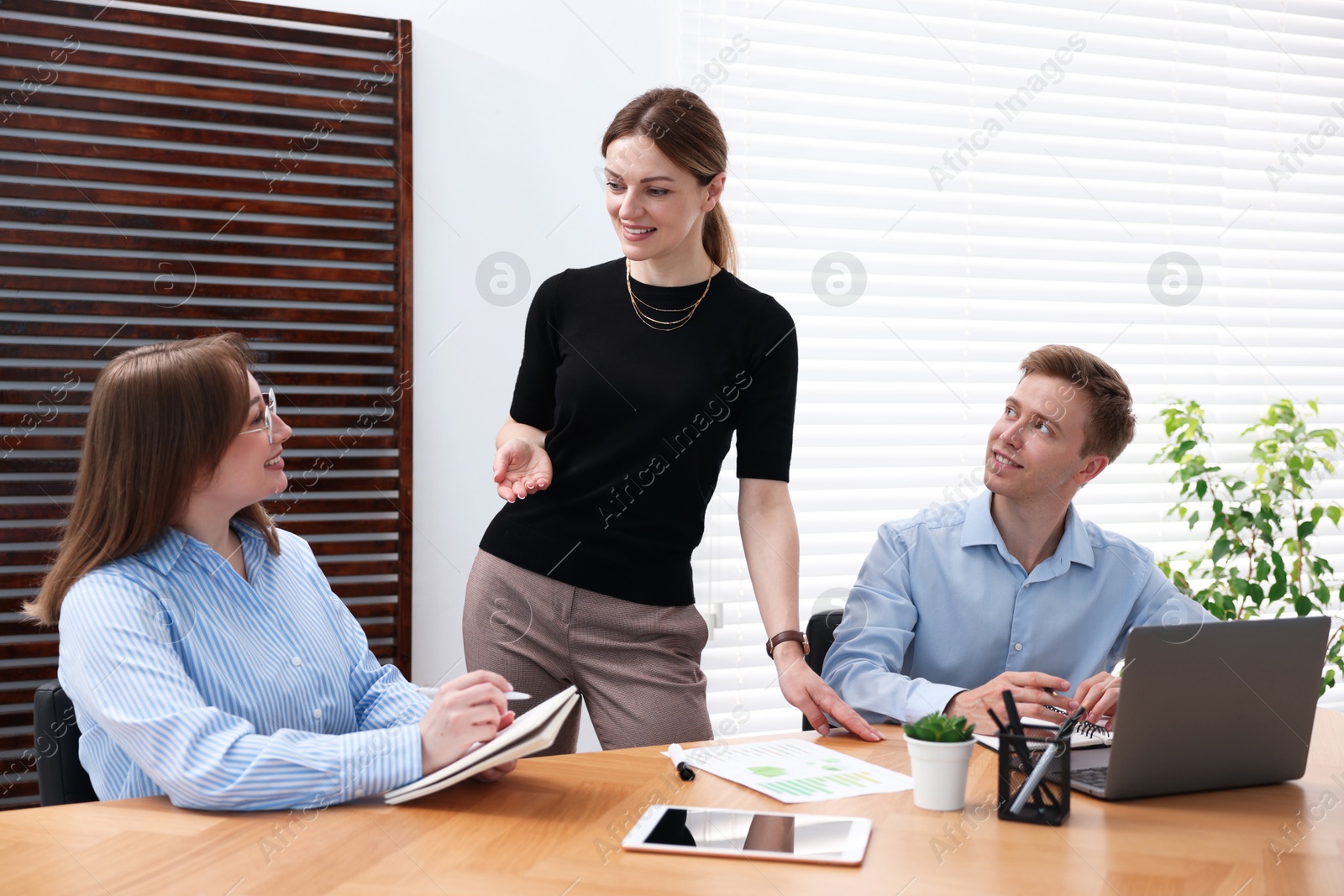 Business coach working with people in office Photo of Business coach working with people in office