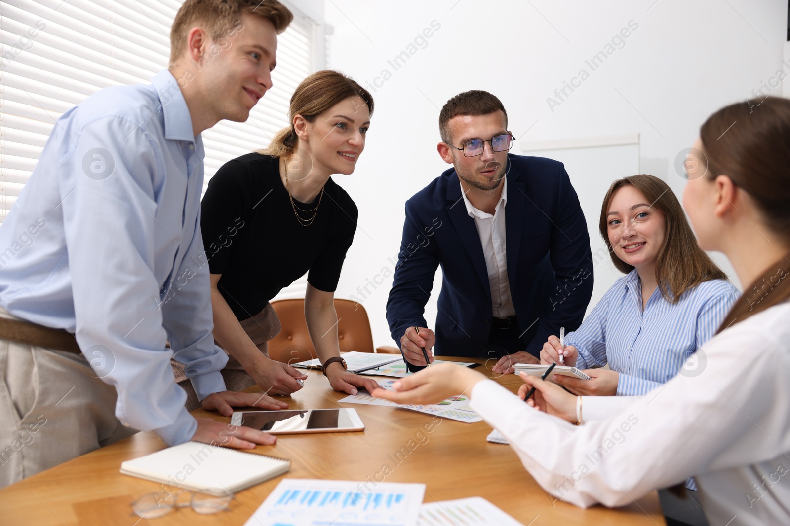 Business coach working with group of people in office Photo of Business coach working with group of people in office