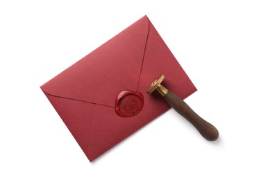 Photo of Envelope with wax seal and stamp isolated on white, top view