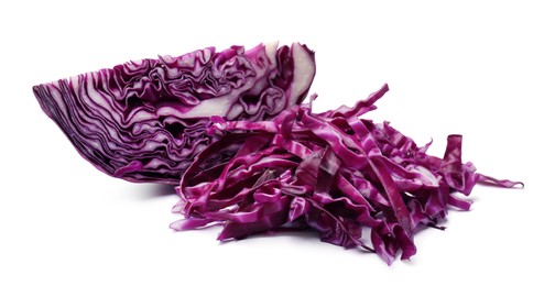 Photo of Pile of shredded red cabbage and piece of fresh one isolated on white