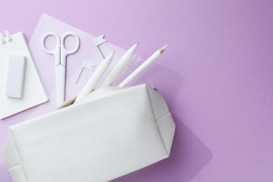 Photo of Different white stationery on violet background, flat lay. Space for text