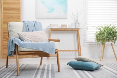 Photo of Comfortable armchair in living room. Interior design
