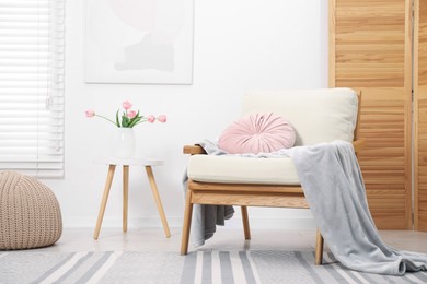 Photo of Comfortable armchair in living room. Interior design