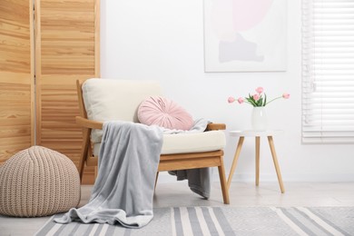 Photo of Comfortable armchair in living room. Interior design