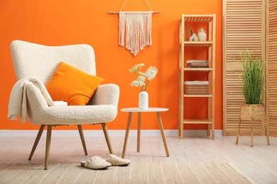 Photo of Comfortable armchair in living room. Interior design