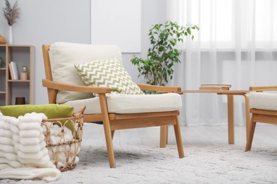Photo of Comfortable armchairs and other furniture in living room. Interior design