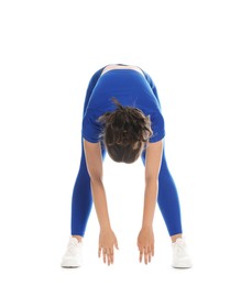 Photo of Teenage girl in sportswear stretching on white background