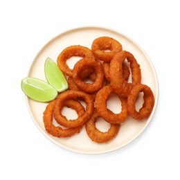 Photo of Fried squid rings and lime isolated on white, top view