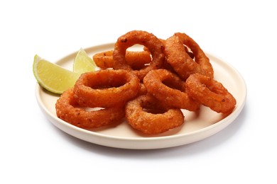 Photo of Fried squid rings and lime isolated on white