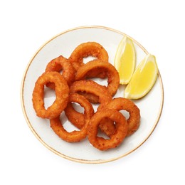 Photo of Fried squid rings and lemon isolated on white, top view