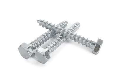Photo of Three metal bolts isolated on white. Hardware tool