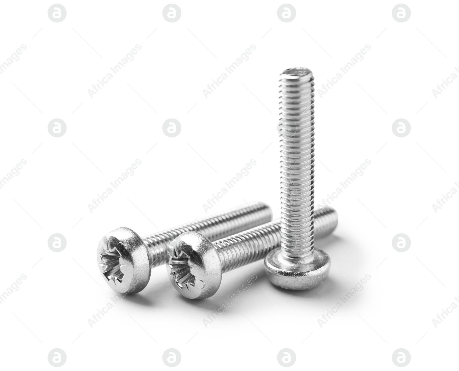 Three metal bolts isolated on white. Hardware tool Photo of Three metal bolts isolated on white. Hardware tool