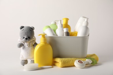 Photo of Baby accessories and body care products on light grey background