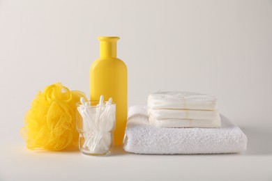 Photo of Baby accessories and body care products on light grey background