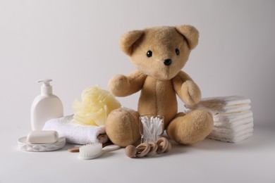 Photo of Baby accessories and body care products on light grey background