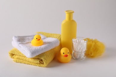Photo of Baby accessories and body care products on light grey background