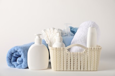 Photo of Baby accessories and body care products on light background