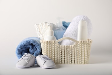 Photo of Baby accessories and body care products on light background