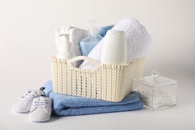 Photo of Baby accessories and body care products on light background