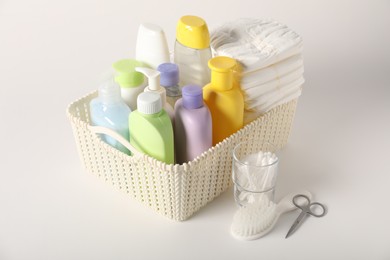 Photo of Baby accessories and body care products on light background