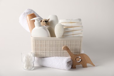 Photo of Baby accessories and body care products on light background