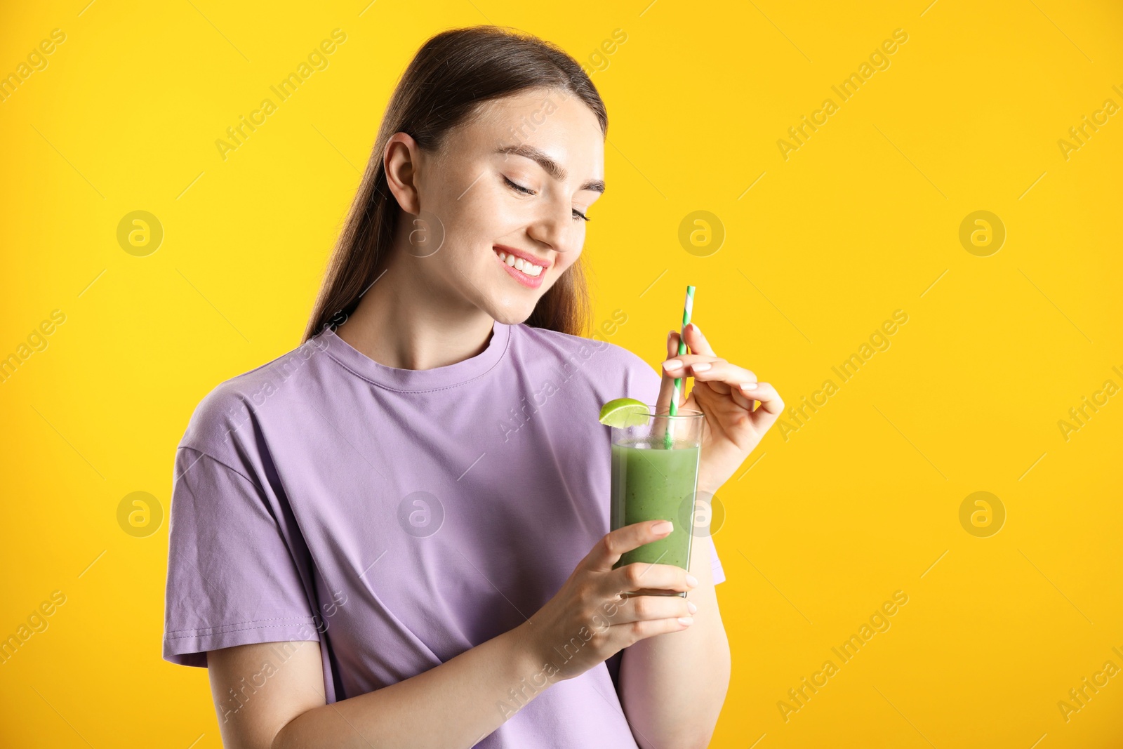 Photo of Woman with refreshing drink and straw on orange background, space for text