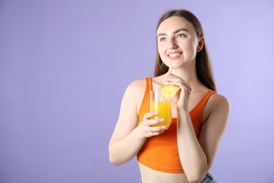 Photo of Woman with refreshing drink and straw on violet background, space for text