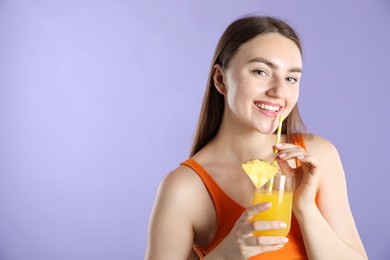 Photo of Woman with refreshing drink and straw on violet background, space for text