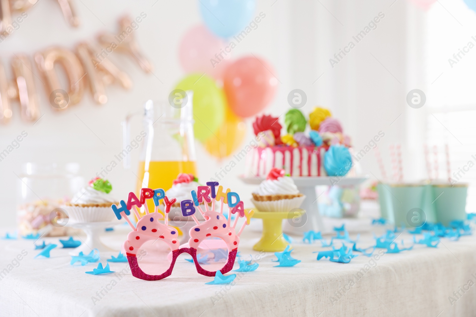 Birthday celebration. Different treats and decor on table indoors, closeup Photo of Birthday celebration. Different treats and decor on table indoors, closeup
