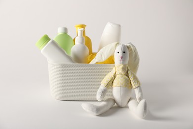 Photo of Baby accessories and body care products on light grey background